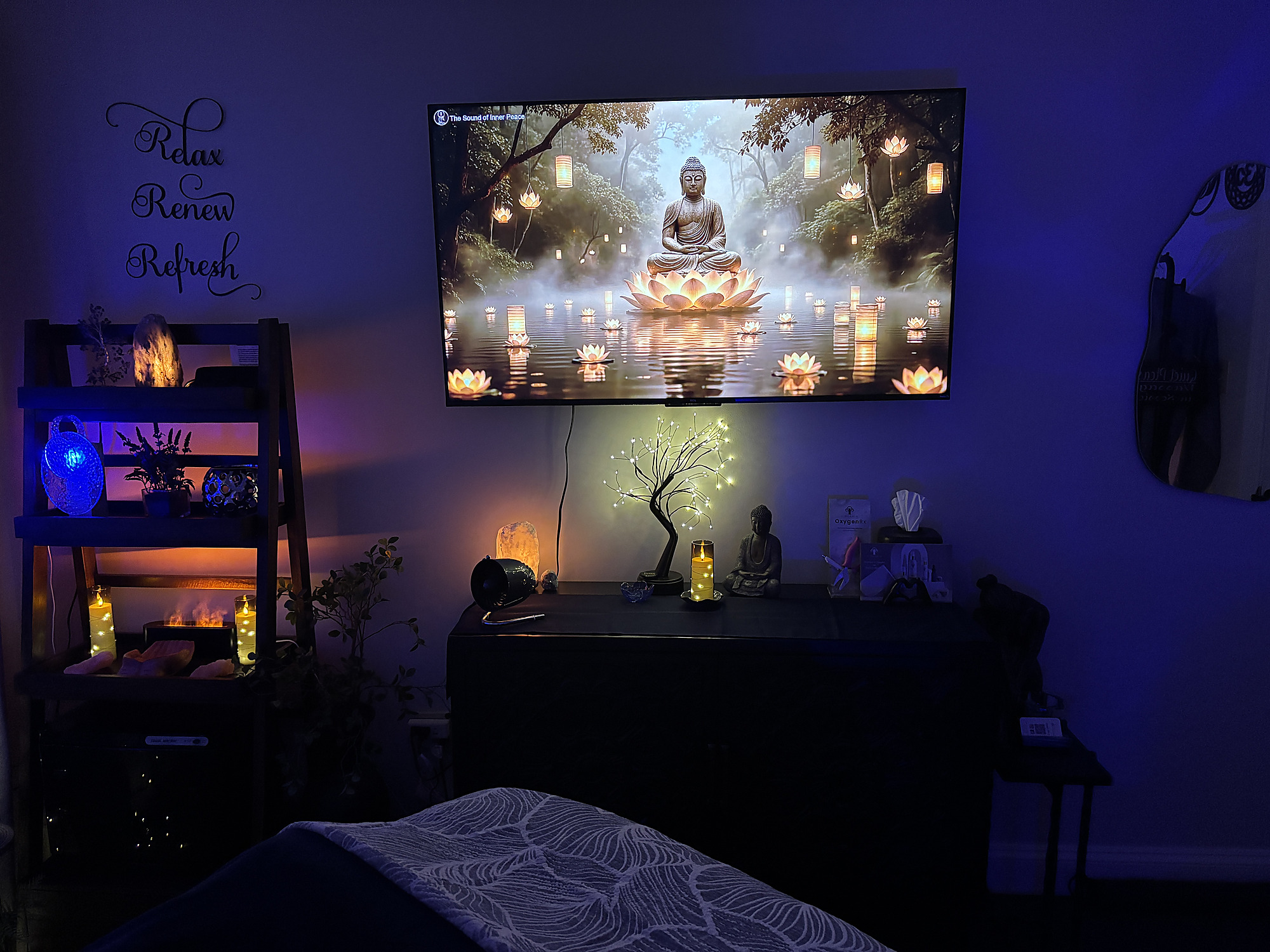 The infusion room at Lux Eternal Spa, lit low with candles and salt lamps