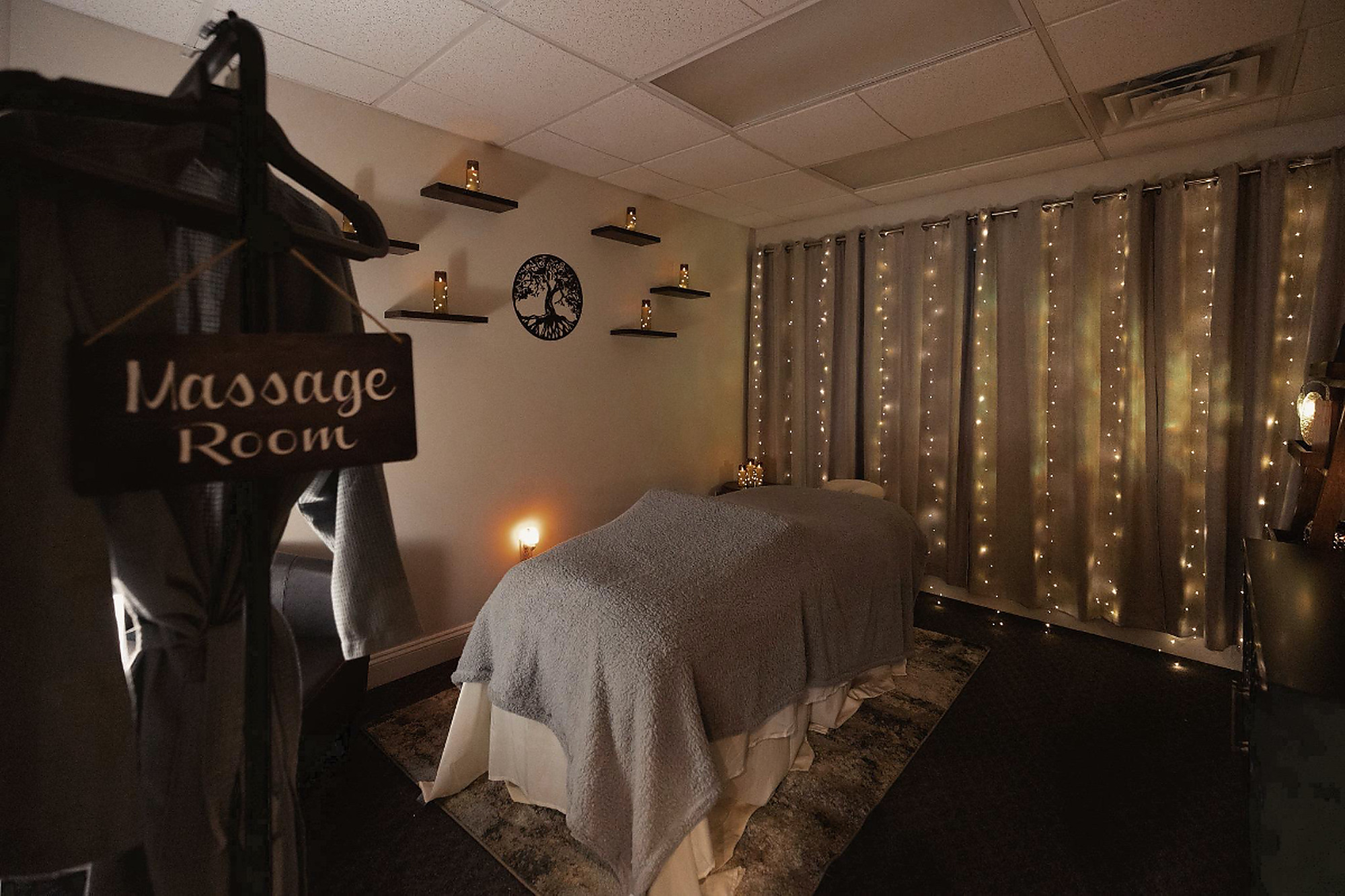 The massage room at Lux Eternal Spa, lit by string lights
